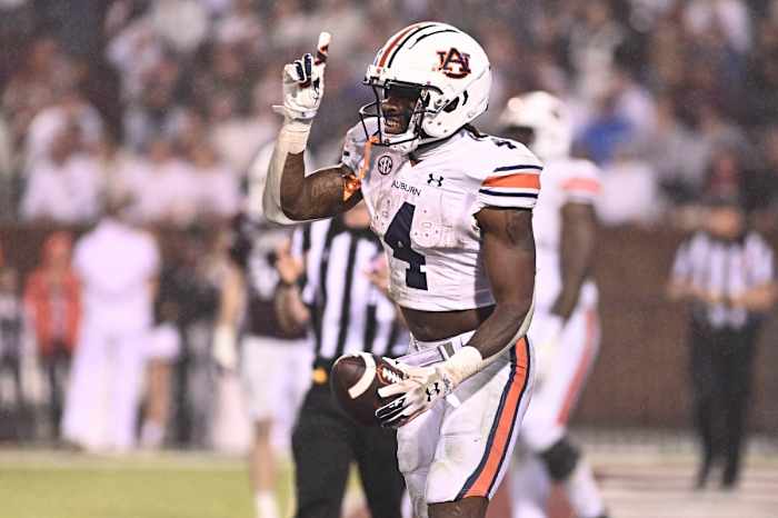 Nov 5, 2022; Starkville, Mississippi, USA; Auburn Tigers running back Tank Bigsby (4) reacts after a touchdown against the Mississippi State Bulldogs during the fourth quarter at Davis Wade Stadium at Scott Field. Mandatory Credit: Matt Bush-USA TODAY Sports